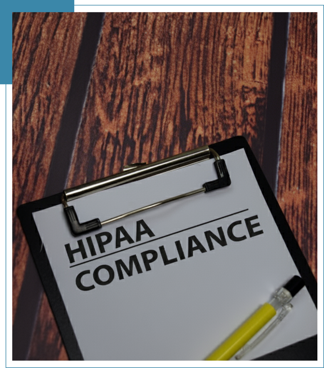 Clipboard with "HIPAA Compliance" document and pen.